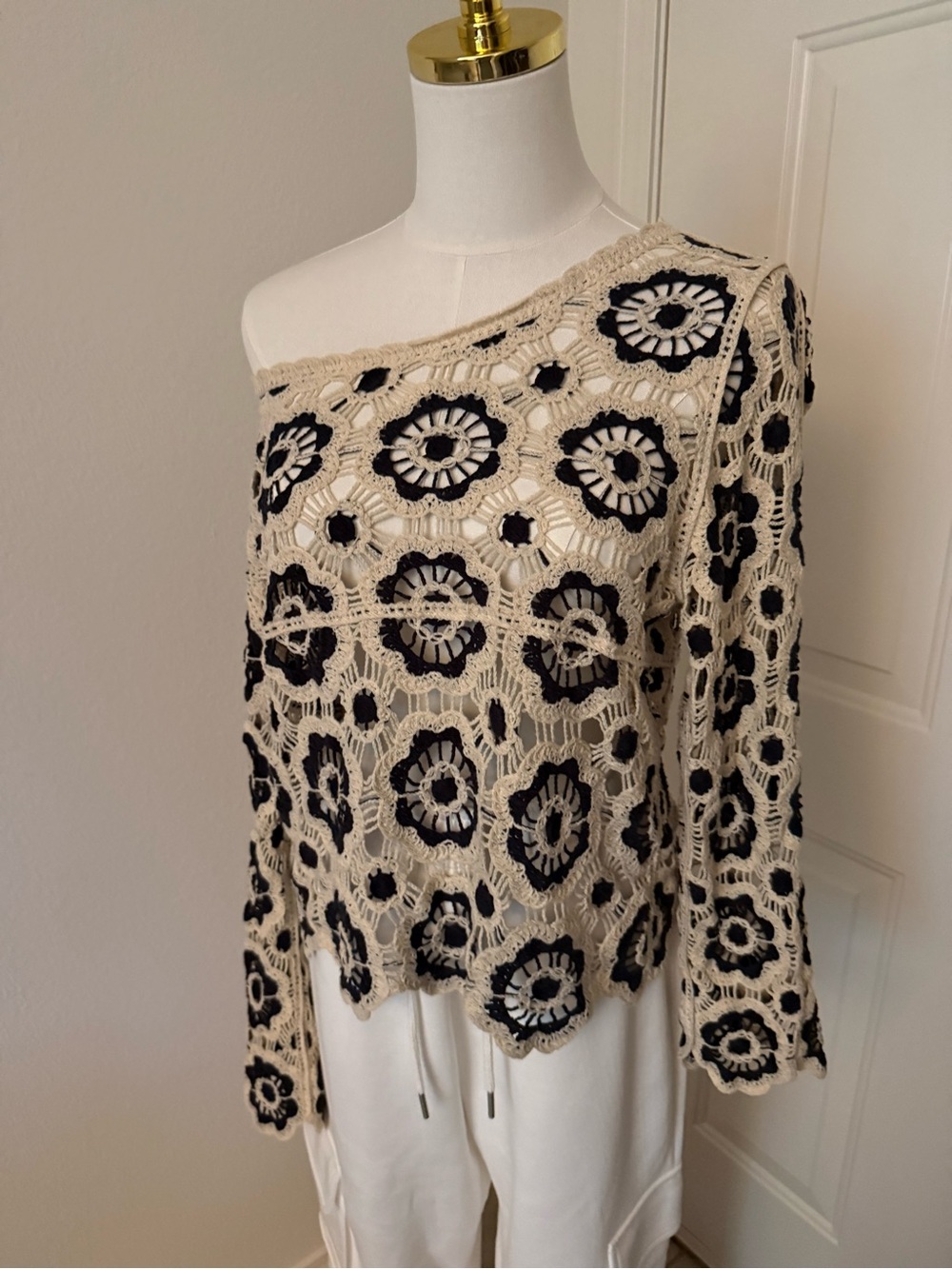 Off-Shoulder Crochet Sweater in Beige with Black Floral Motifs